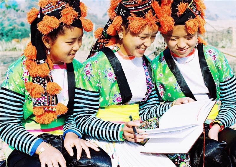 Hmong girls in traditional costumes