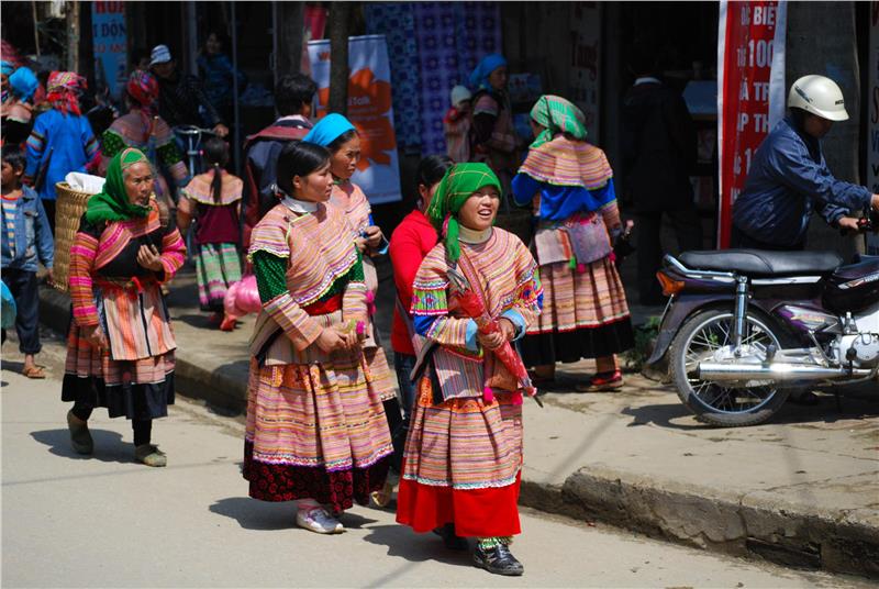 Flower Hmong girls in sneakers at Bac Ha Market