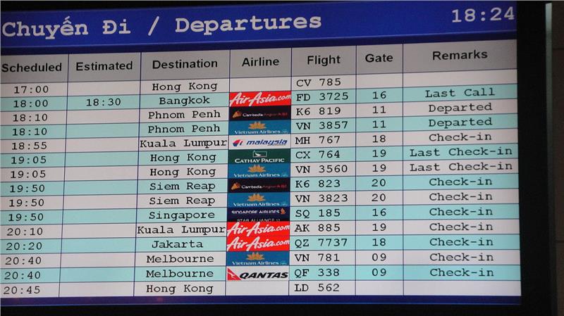 Screen showing departures at Tan Son Nhat International Airport