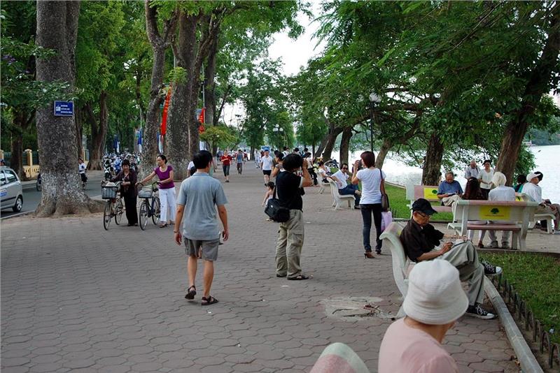 People do morning exercise around Hoan Kiem Lake
